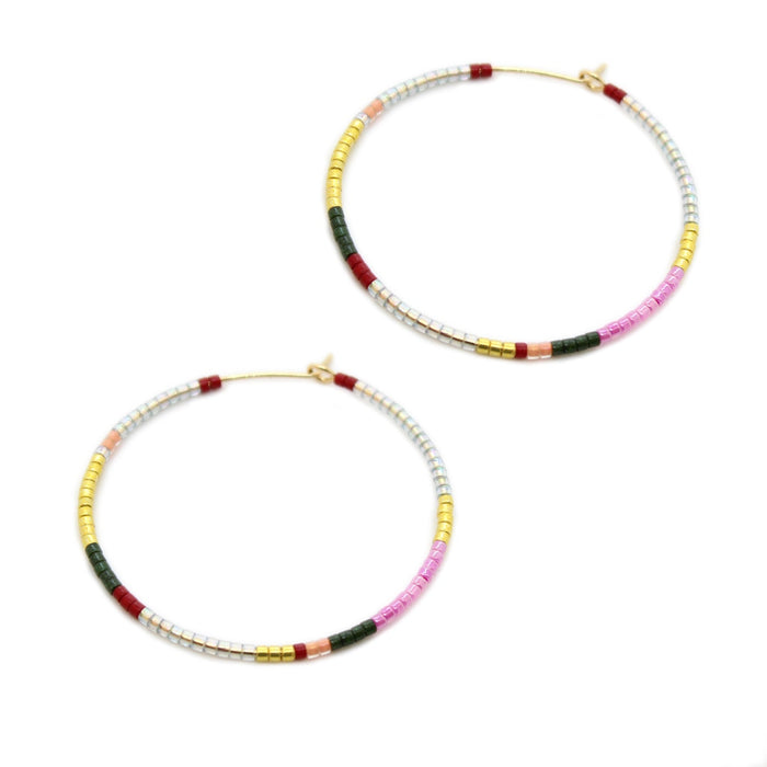 Silver-toned beaded hoop earrings with gold hooks and multicolor bead accents