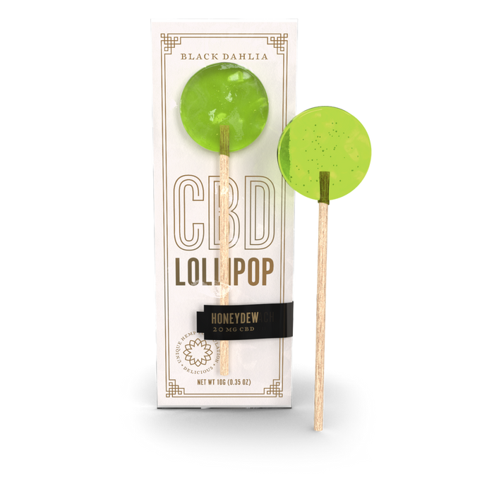 Honeydew CBD lollipop with green hard candy on a wooden stick