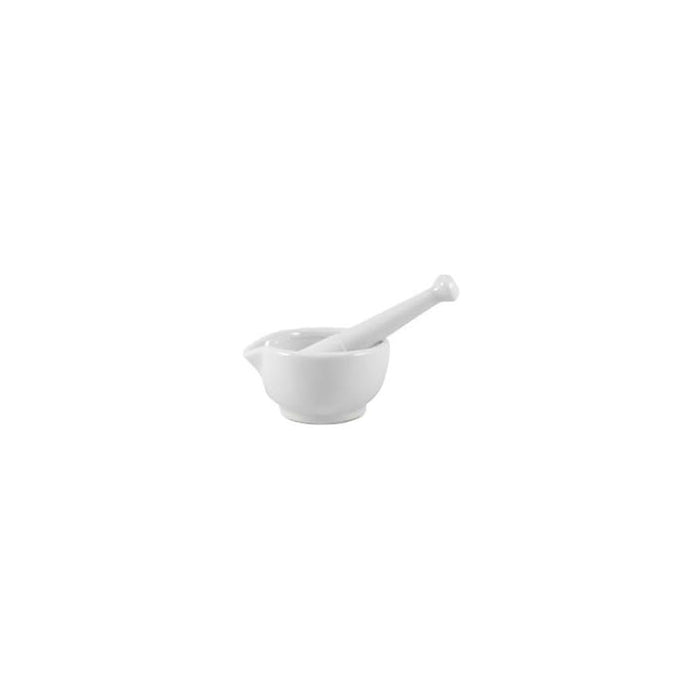 A small, white porcelain mortar and pestle rests on a white background.