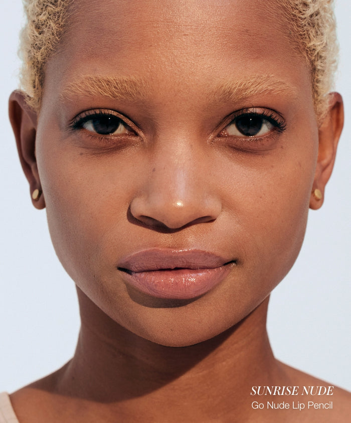 Close-up of a model with natural makeup wearing RMS Beauty Color Capsule: Strawberry Matcha lip pencil in a subtle nude shade, showcasing clean beauty and natural ingredients.