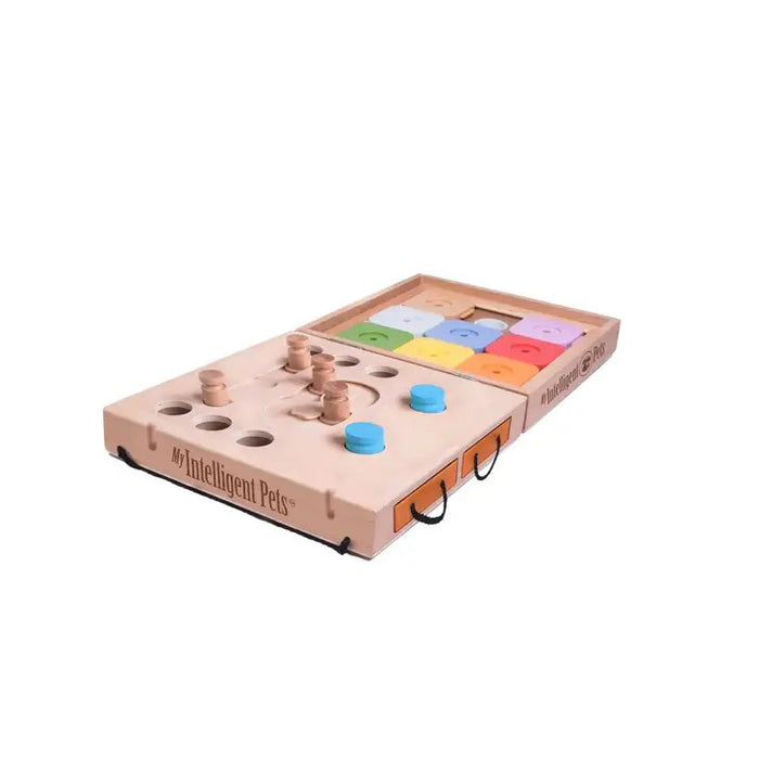 The MY INTELLIGENT PETS DOG TRAVEL PUZZLE 2 IN 1 is a portable dog toy with movable knobs, sliders, and compartments in natural wood tones and bright colors—ideal for interactive pet play on the go.