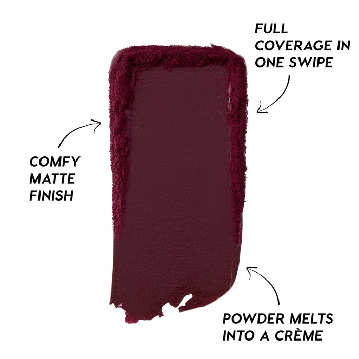 Deep berry swipe of Newborn Powder To Creme Lipstick from the Twilight collection, showing rich full-coverage color with a comfy matte finish and creamy texture against a clean white background.