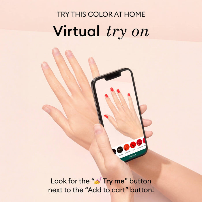 A hand holds a phone displaying Manucurist's virtual try-on app, featuring "Red Cherry" nail polish on digital nails. The pale pink background highlights text promoting the easy virtual try-on for nail colors.