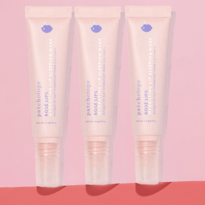 Three Patchology Rosé Lips lip sleeping mask tubes displayed on a soft pink background