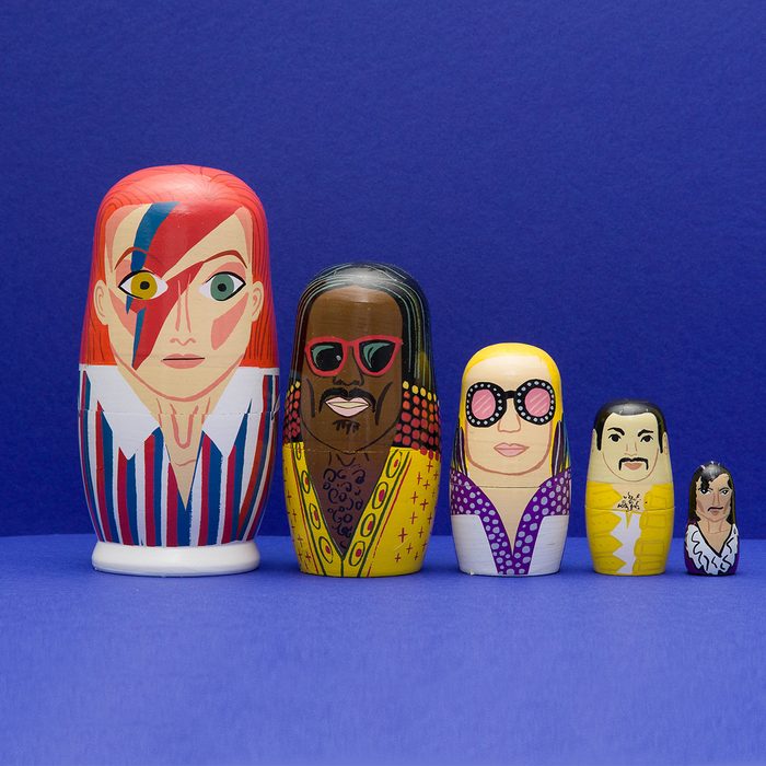 Set of 70s Men of Pop wooden nesting dolls from Larney + Babs, featuring colorful vintage-themed male figures in a gift box.