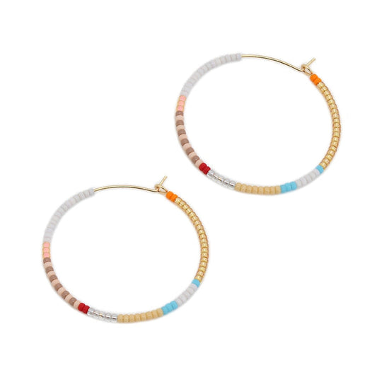 Beaded hoop earrings with gold hooks, light gray and tan beads, red/orange/blue accents