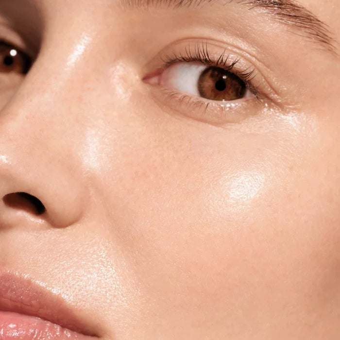 Close-up of a glowing face with hydrated skin using Augustinus Bader hydrogel face mask