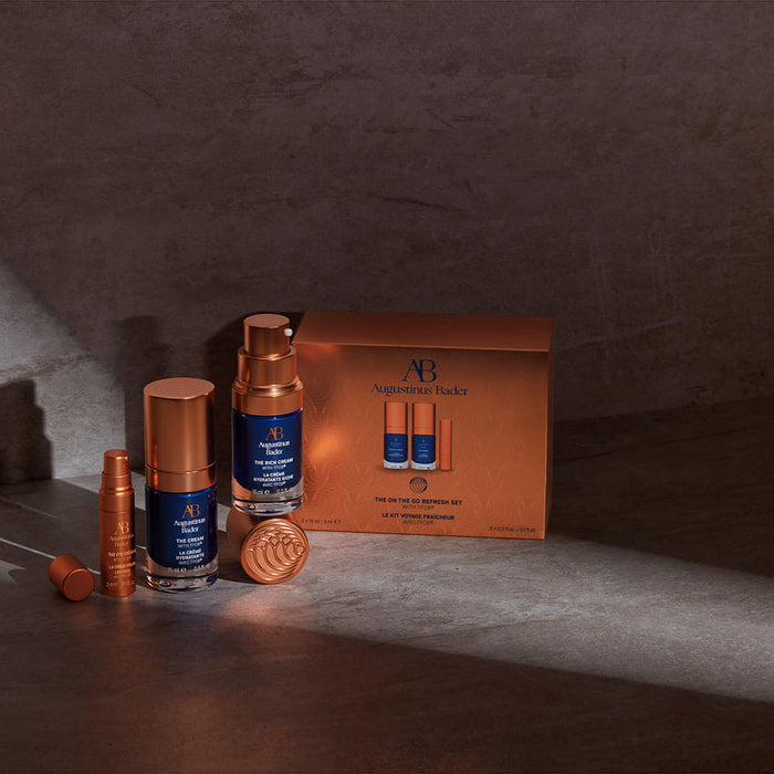 Augustinus Bader On The Go Refresh Set with travel-size creams and eye cream in copper packaging