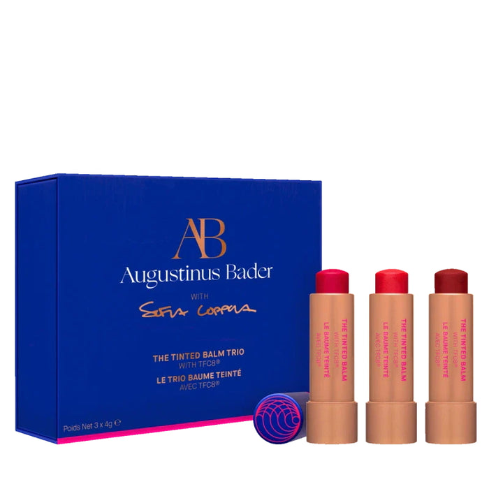 Augustinus Bader The Tinted Balm Trio with three tinted lip balms in pink, coral and red