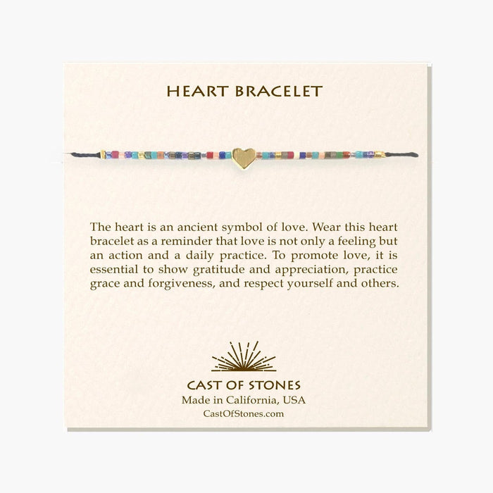 Bright beaded bracelet featuring a centered gold-tone heart charm and woven bead band.