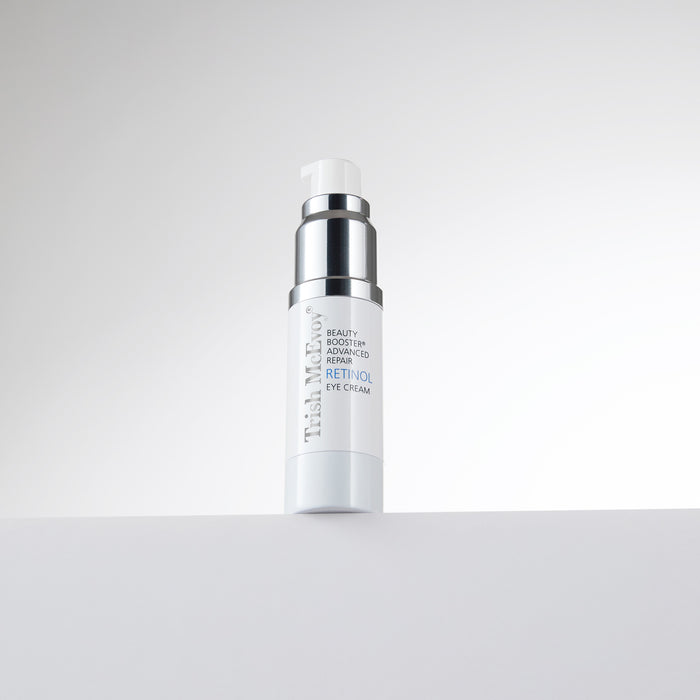 Skincare bottle with text on a light gray background