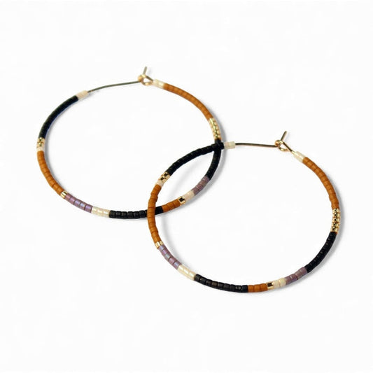 Beaded hoop earrings with black, brown and gold-toned bead accents