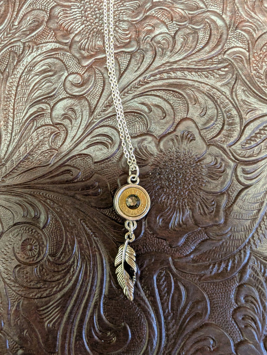 BadAssBabe Caliber Bezel Necklace with Dangle, featuring a sleek chain and a stylish bezel pendant with dangling detail.