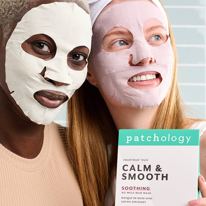 Two women wearing white and pink sheet masks holding Patchology Calm & Smooth duo, soothing skincare treatment together