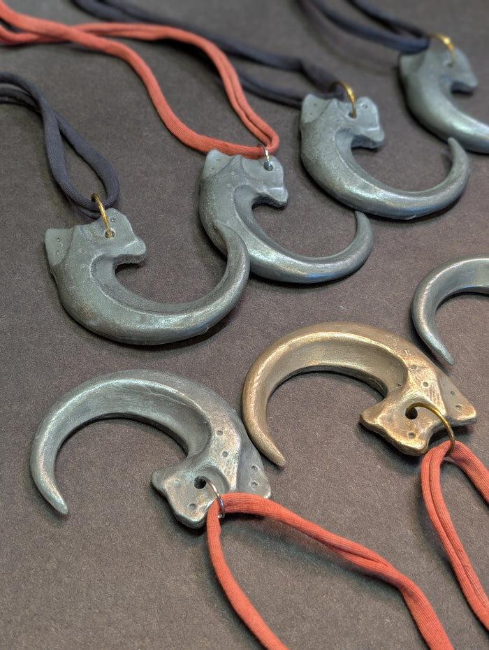 COLD CAST METAL CLAW PENDANT
