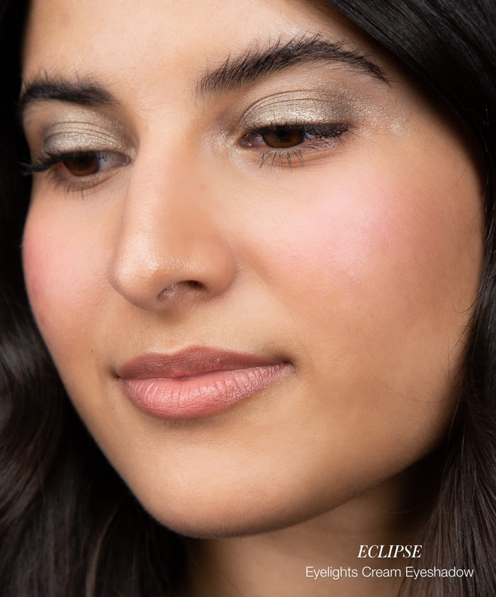 Close-up of a woman wearing natural makeup with soft, shimmering eyelids and a subtle blush highlighting the cheeks using Color Capsule: Strawberry Matcha, showcasing clean beauty and natural ingredients.