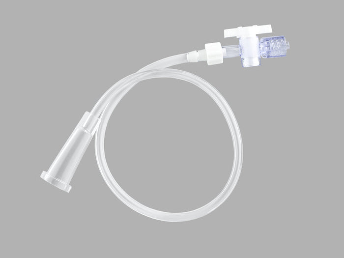 A white, flexible medical tube with two prongs at one end and a connector at the other, lies coiled against a plain grey background.
