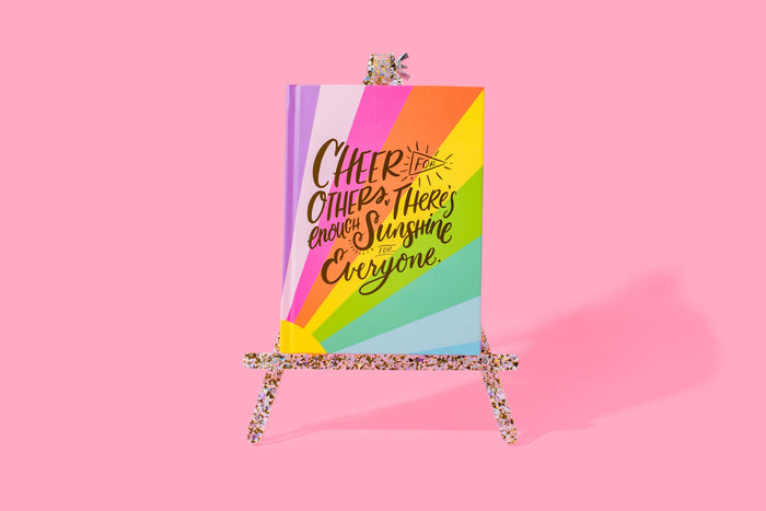 Medium decorative easel from Taylor Elliott Designs with pearl and gold confetti accents, perfect for display or presentation.