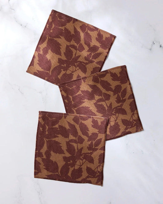 Dishcloth set of 3 in rust brown with leaf pattern, folded and neatly stacked