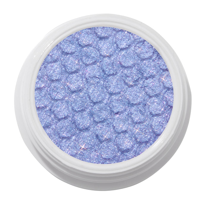 Dream Much shimmering lavender ColourPop Super Shock Shadow, a glittery lilac eyeshadow with bouncy dimpled texture, shown in a white round pot on a clean white background.