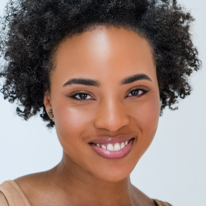 Woman wearing Demure Dark Brown Eye Liner