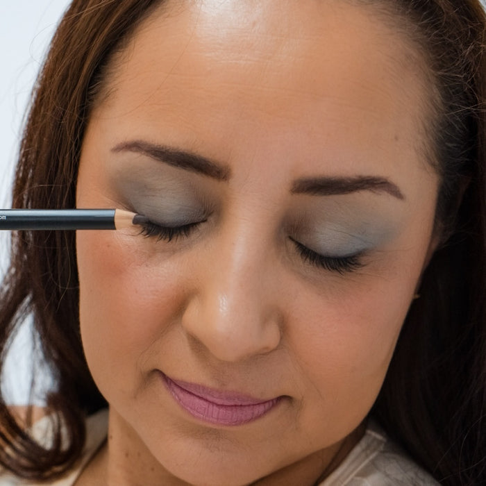 Latino woman wearing Demure Dark Brown Eye Liner
