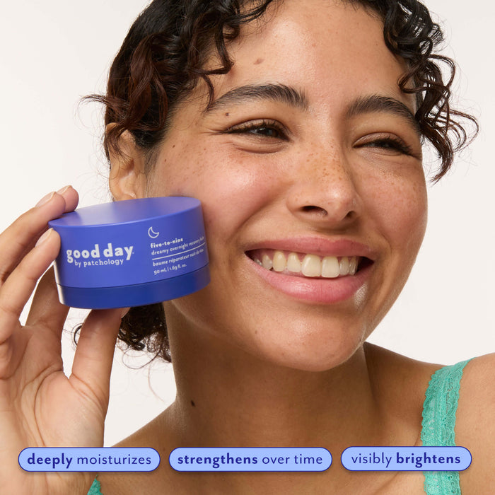 A smiling woman holds a blue jar of five-to-nine dry skin cream next to her face against a clean white background, with three feature callout banners at the bottom.