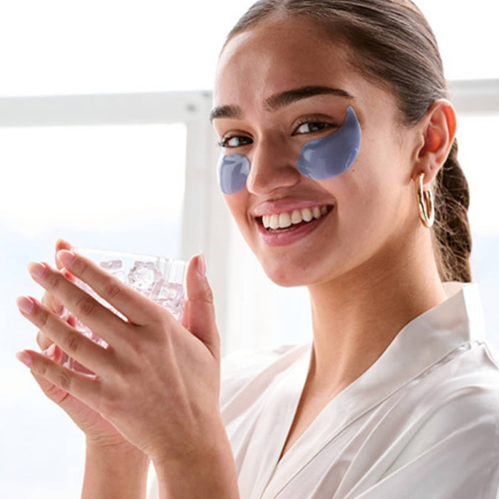 woman wedding day prep eye masks to firm and smooth pre-makeup on ice eye gels