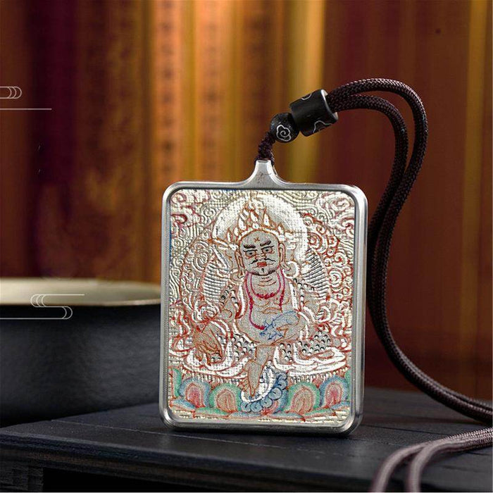 Handpainted Locket Thangka Amulet,White Jambhala,Buddha of Wealth - Tibetan thangka painting, close-up detail