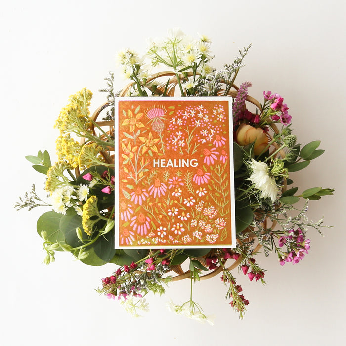 Sympathy card with orange botanical pattern, flowers, and 'HEALING' text