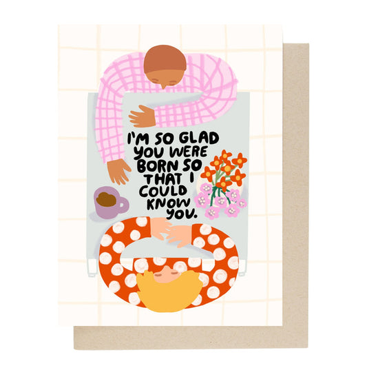 Birthday card with illustrated people, flowers, and message: “I'm so glad you were born”.