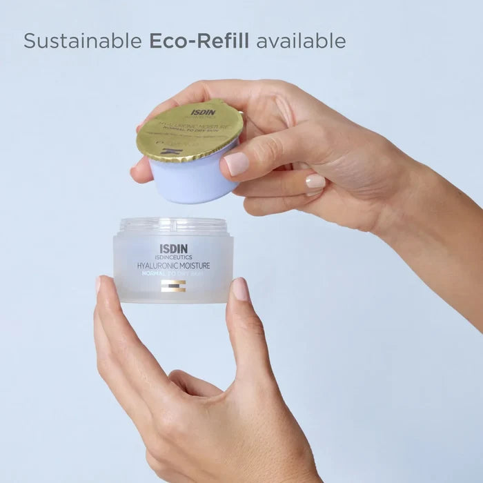 ISDIN Isdinceutics Hyaluronic Moisture eco-refill jar with golden lid, held above moisturizer jar