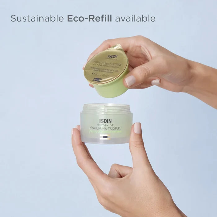 Hand holding ISDIN Hyaluronic Moisture Oily Eco-Refill with jar and refill pod