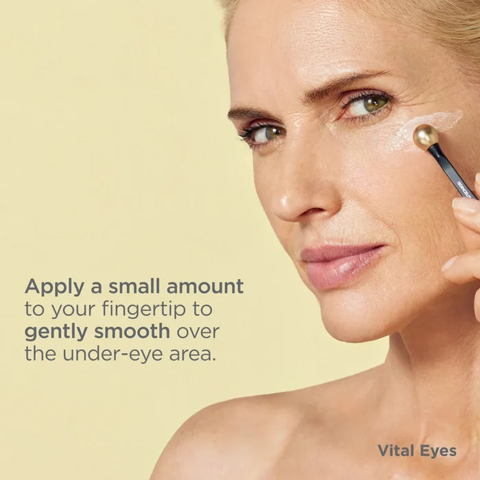 Woman applying ISDIN Vital Eyes under-eye cream with applicator, smooths eye contour