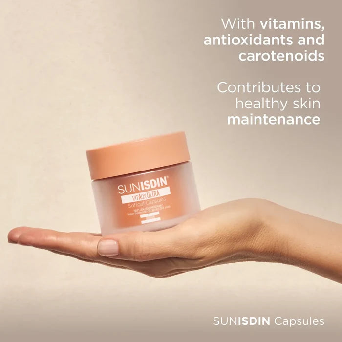 SUNISDIN vitAOX ULTRA softgel capsules jar on hand, with vitamins, antioxidants and carotenoids