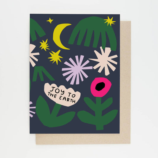 Greeting card front with green leaves, yellow moon and stars, white burst shapes, and pink ornament.