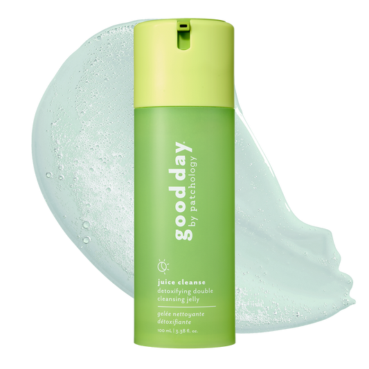 A bottle of Good Day by Patchology Juice Cleanses Detoxifying Double Cleansing Jelly in a light green and lime green color scheme, shown with a large translucent light green jelly smear behind it on a white background.