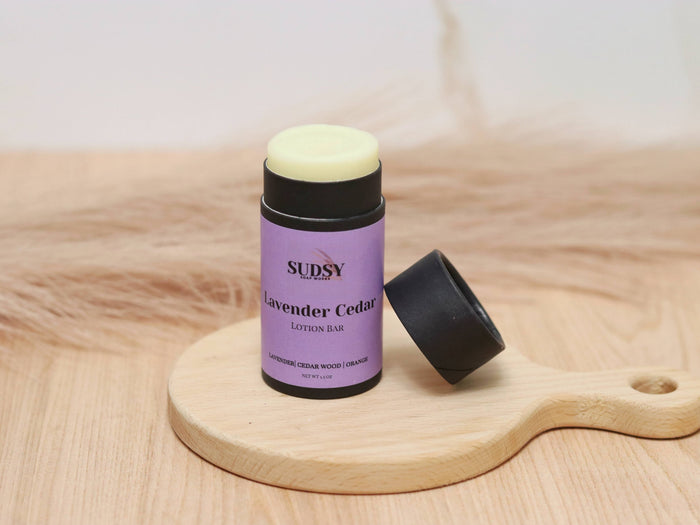 Lavender and cedar natural lotion bar by Sudsy Soap Works LLC, showing a sleek, eco-friendly solid moisturizer with lavender and cedar scent
