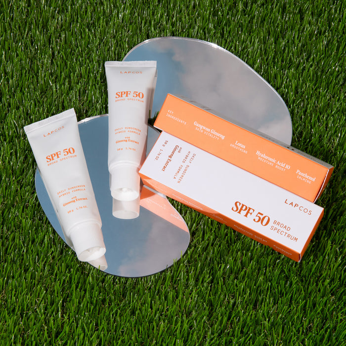 LAPCOS SPF 50 hybrid sunscreen in grass