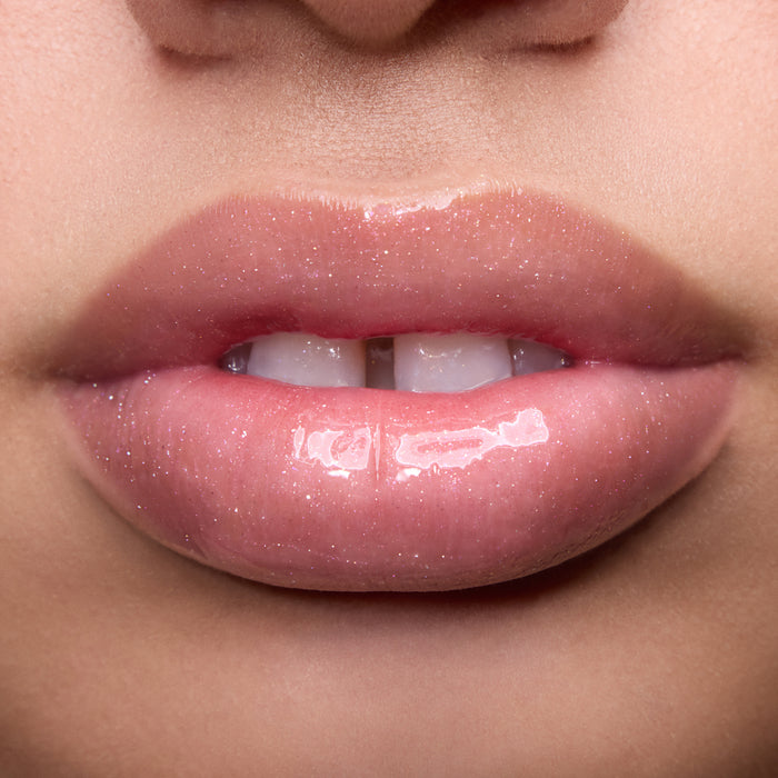 Close-up of models’ lips wearing Colourpop Fresh Kiss Glossy Balm in Raspberry Crème, showing sheer pink shimmer Lip Gloss & Lip Oil finish on different skin tones against a simple studio background.
