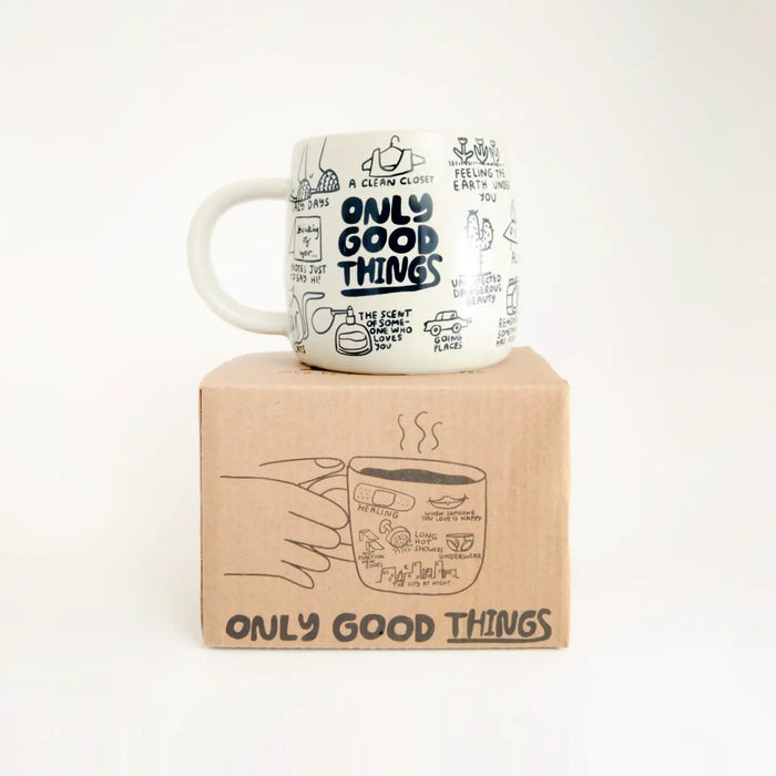 Cream ceramic mug with 'Only Good Things' text and doodle icons