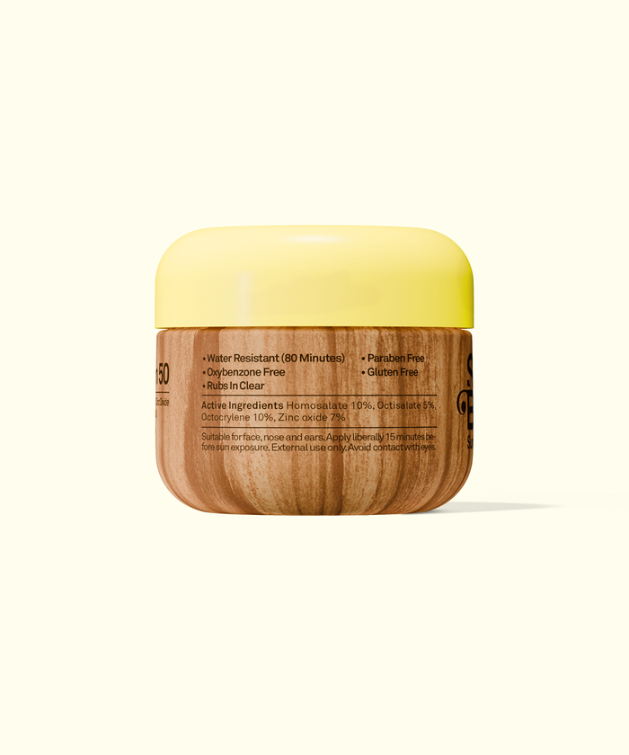 Sun Bum Original SPF 50 Face Cream in a wood-textured jar with a yellow lid showing product details.