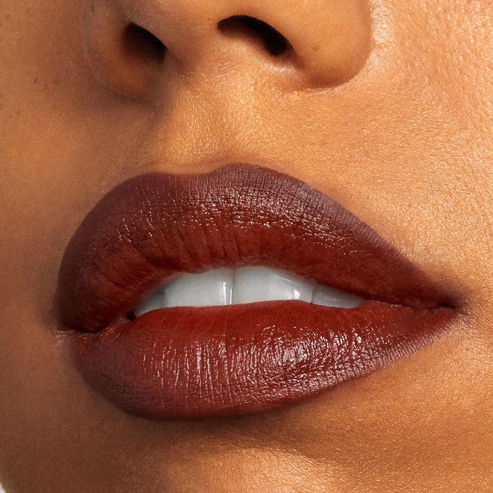 Full lips lined and filled with Pitch, a rich warm chocolate-brown ColourPop Lippie Pencil, delivering a smooth satin finish and crisp definition in a tight close-up beauty shot.