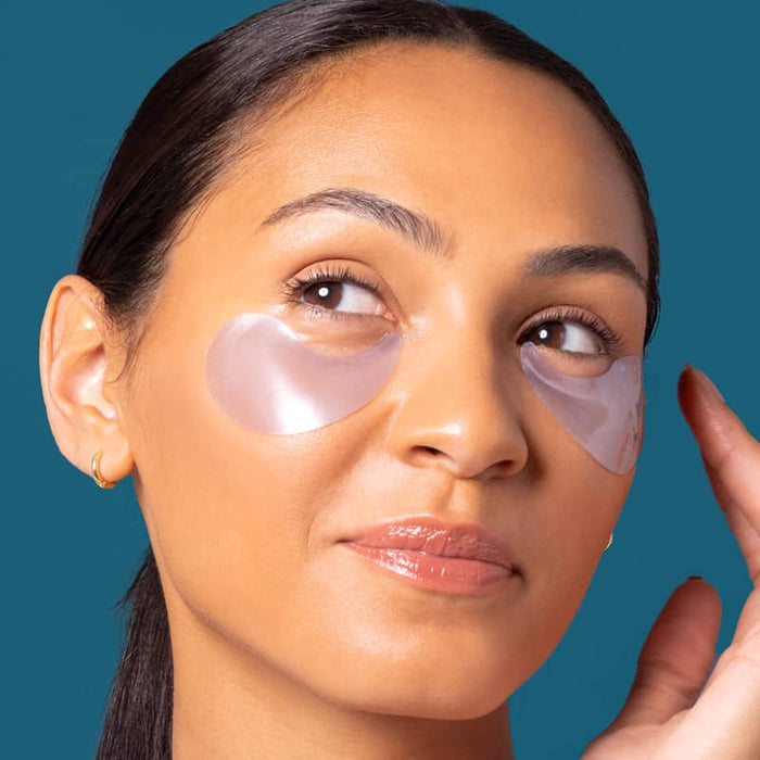 woman wearing retinol undereye patches to firm and smooth fine lines