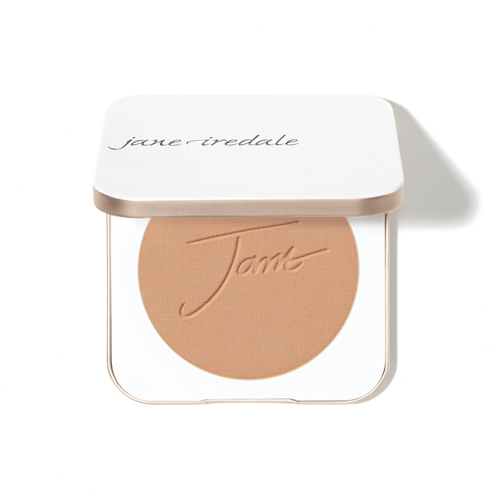 A compact with refill of Jane Iredale PurePressed Base Mineral Foundation in a matte finish, housed in a white square container in a shade of medium skin tone.