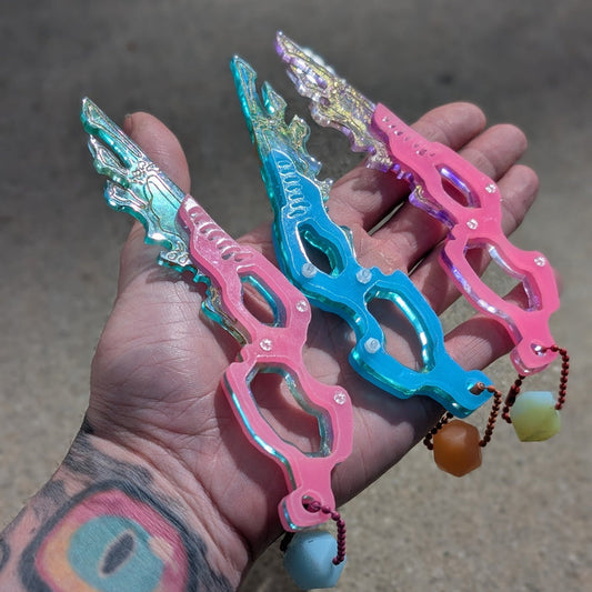 SEPIOID GALACTIC FEATHER GLOW CHARM