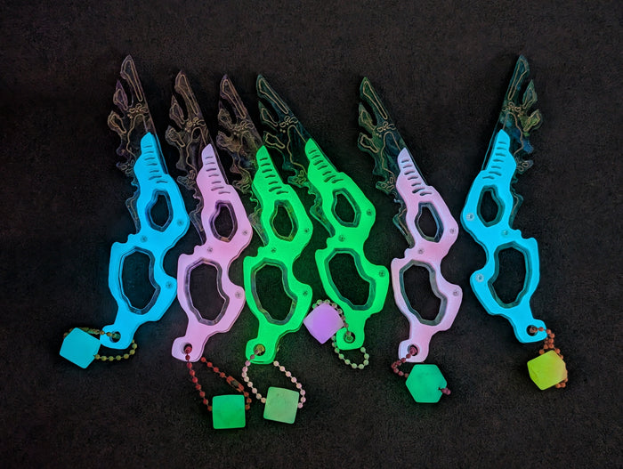 SEPIOID GALACTIC FEATHER GLOW CHARM