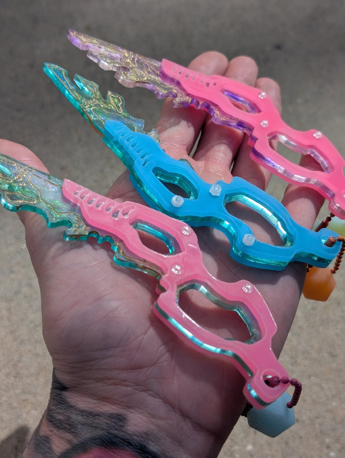 SEPIOID GALACTIC FEATHER GLOW CHARM
