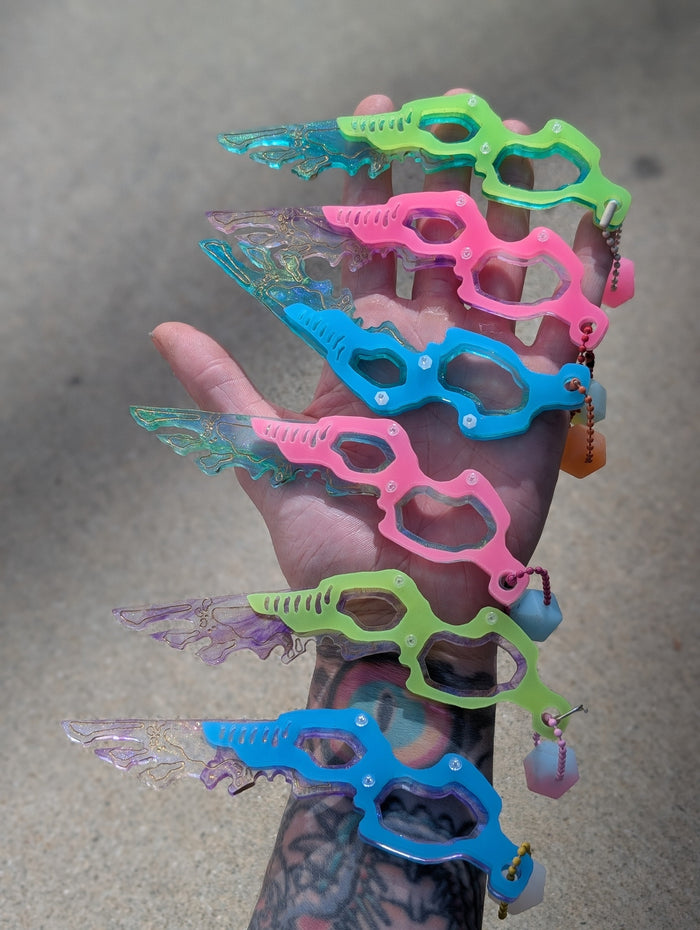 SEPIOID GALACTIC FEATHER GLOW CHARM