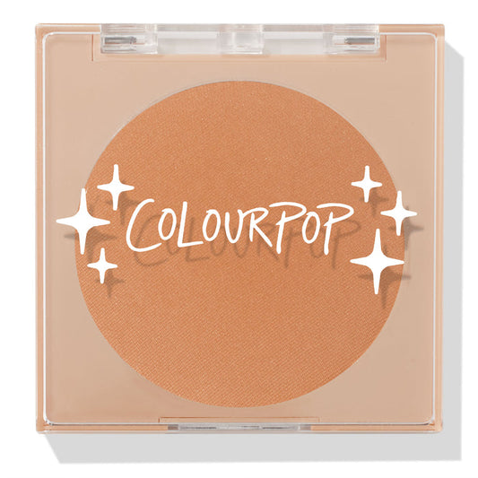 ColourPop Pressed Powder Bronzer in Silver Strand Beach, a warm tan matte shade, shown closed in a square clear compact with white ColourPop logo and star accents on the lid, displaying the full round pan in a sleek beige case.